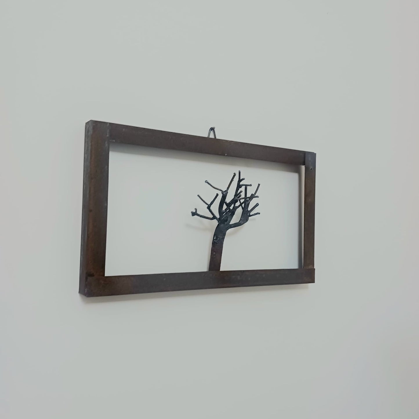 albero in ferro incorniciato "fiorirà"